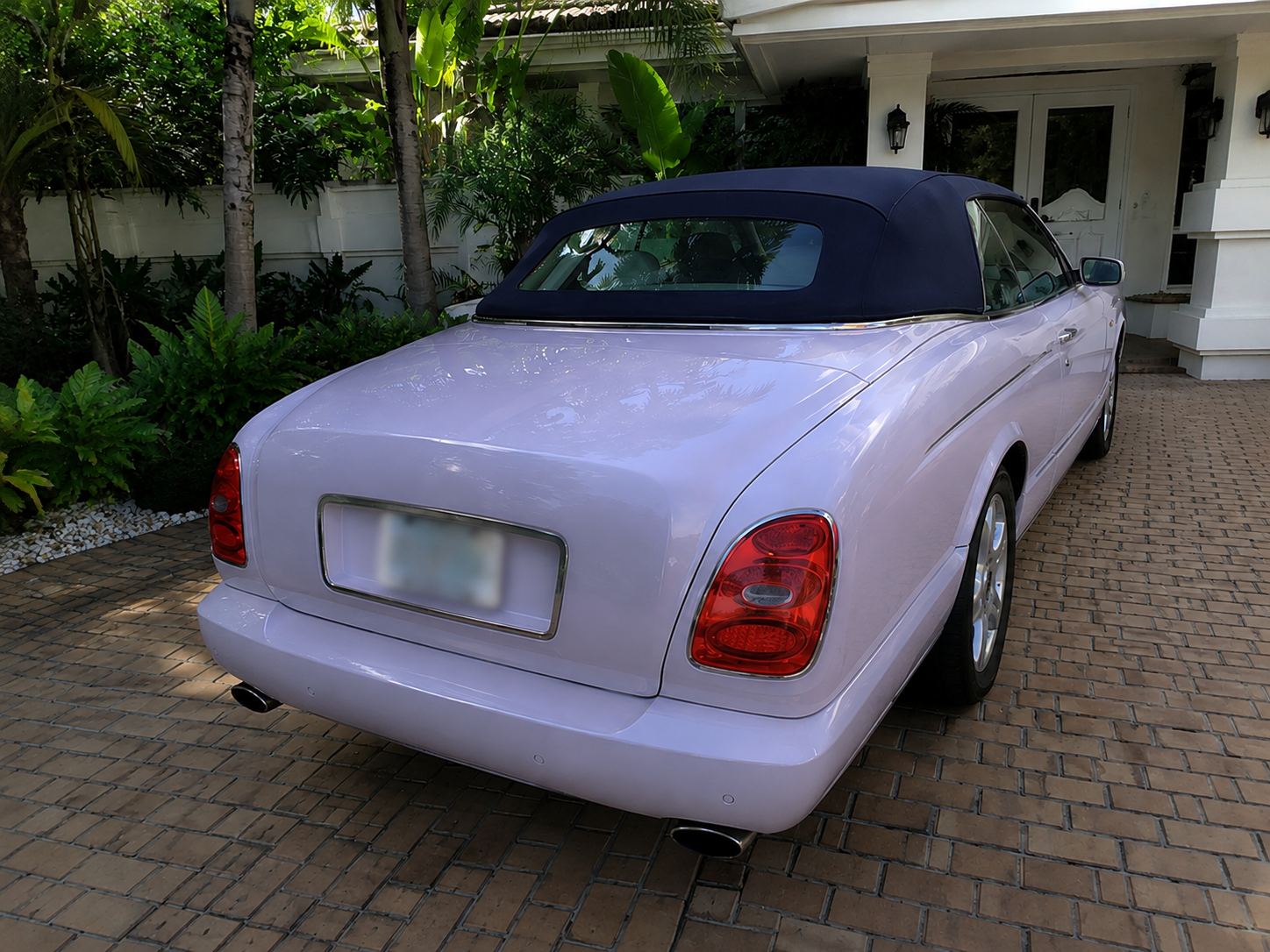Bentley convertible detailed in a South Florida driveway