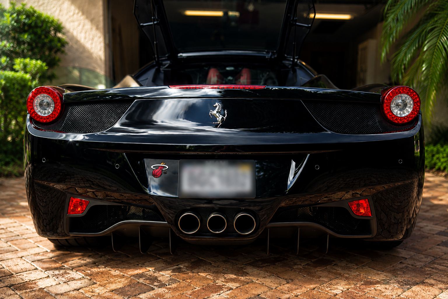 Ferrari 458 rear view in a South Florida driveway
